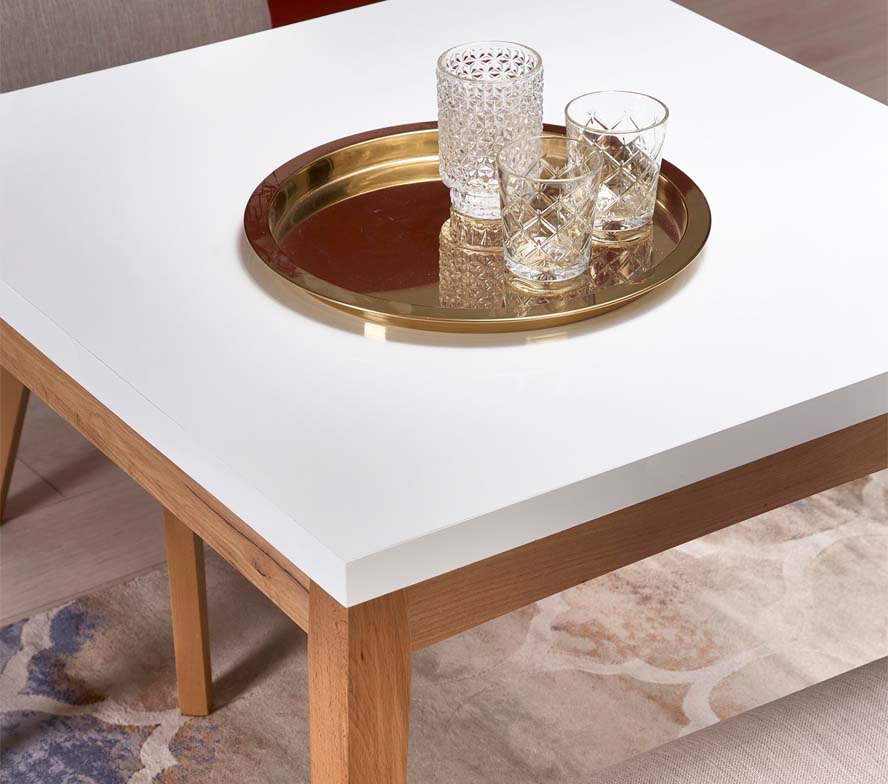 stół rozkładany producenta stołów i krzeseł DDMeble w stylu skandynawskim z blatem w wysokim połysku aranżacji pokazany detal